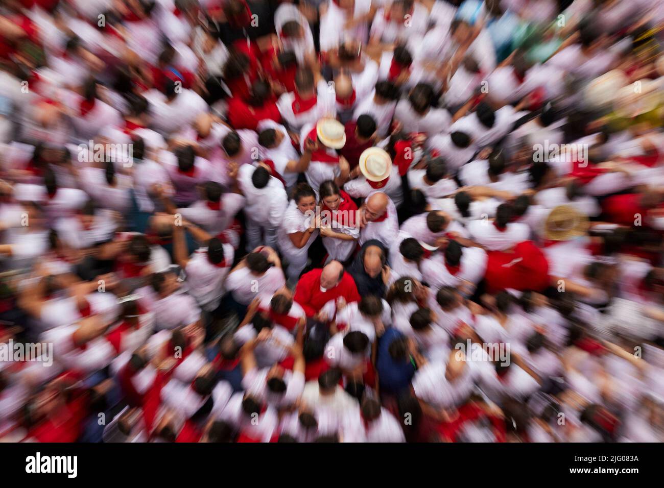 Pamplona, Spain. 06th July, 2022. Revellers enjoy the atmosphere during the opening day or 'Chupinazo' of the San Fermin Running of the Bulls fiesta on July 06, 2022 in Pamplona, Spain. The annual Fiesta de San Fermin, made famous by the 1926 novel of US writer Ernest Hemmingway entitled 'The Sun Also Rises', involves the daily running of the bulls through the historic heart of Pamplona to the bull ring. (Photo by Ruben Albarran / PRESSINPHOTO) Credit: PRESSINPHOTO SPORTS AGENCY/Alamy Live News Stock Photo