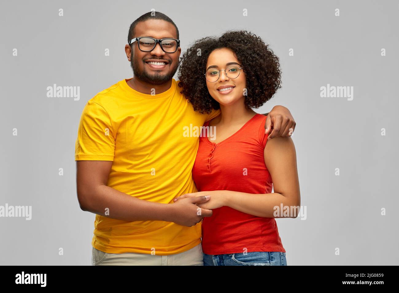 happy african american couple in glasses hugging Stock Photo - Alamy