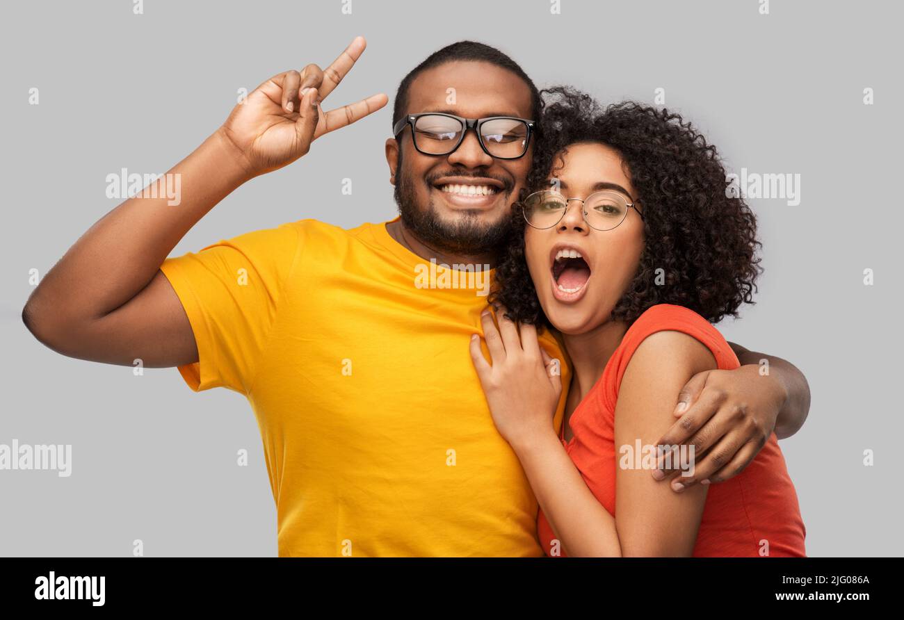happy african american couple in glasses hugging Stock Photo - Alamy
