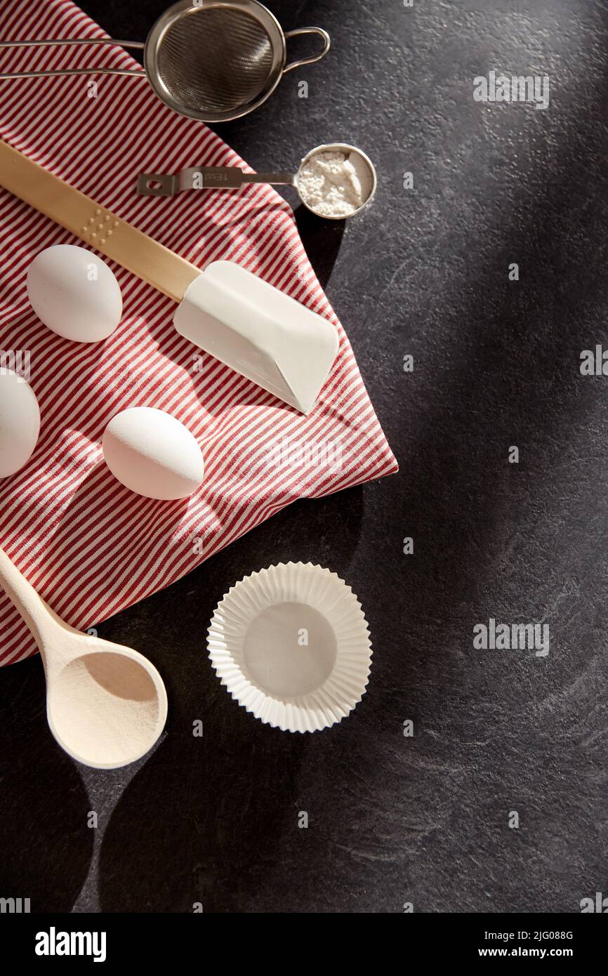 eggs, flour, spoon, spatula, strainer and towel Stock Photo Alamy