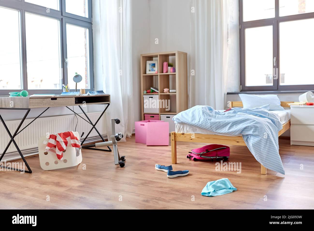 messy home or kid's room with scattered stuff Stock Photo