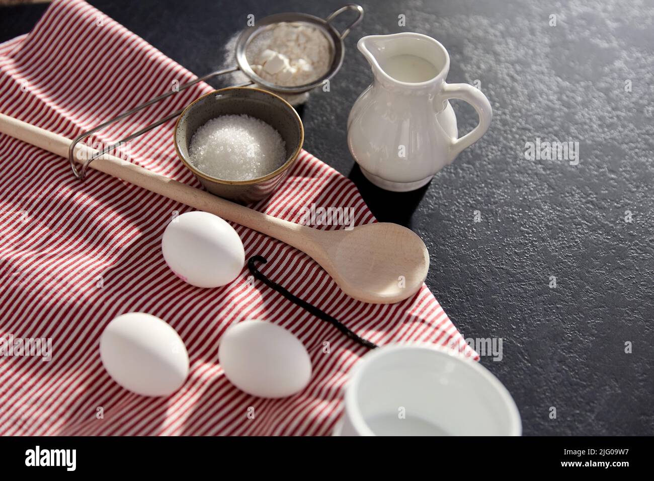 eggs, sugar, milk, flour, spoon and vanilla Stock Photo Alamy