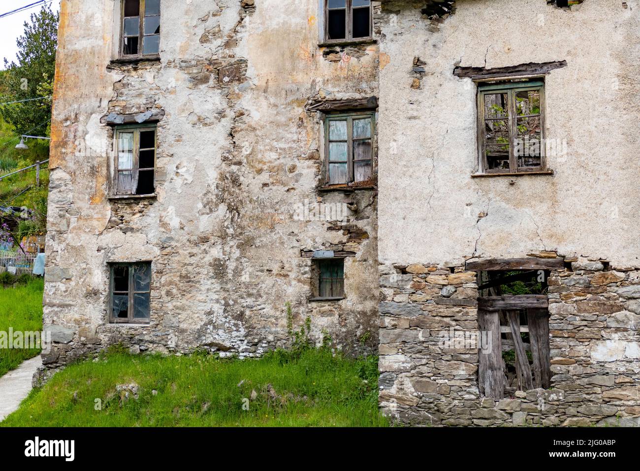 The facade of an old abandoned building with broken windows Stock Photo ...
