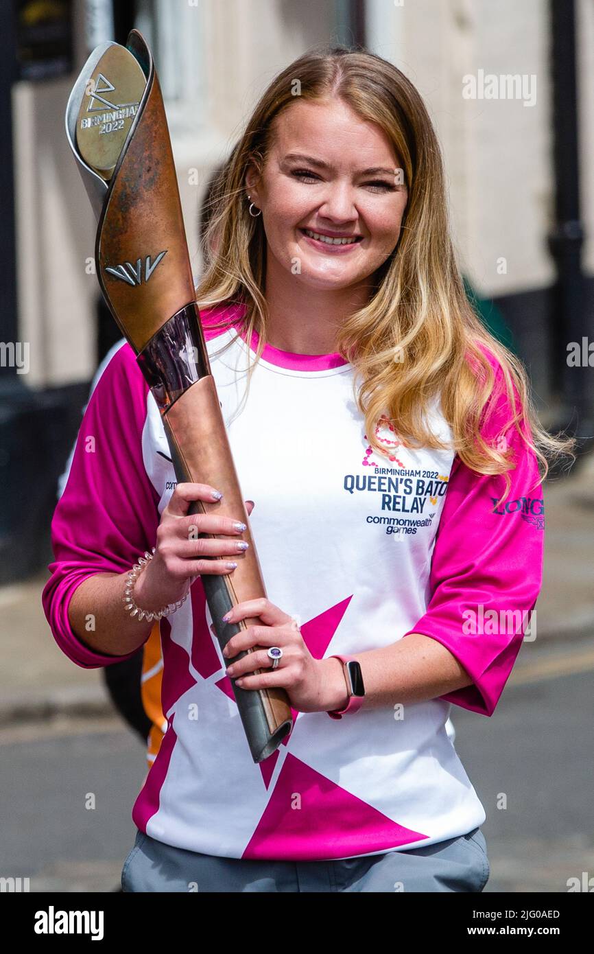 Windsor and Eton, UK. 6th July, 2022. Batonbearer Jemma Wood carries