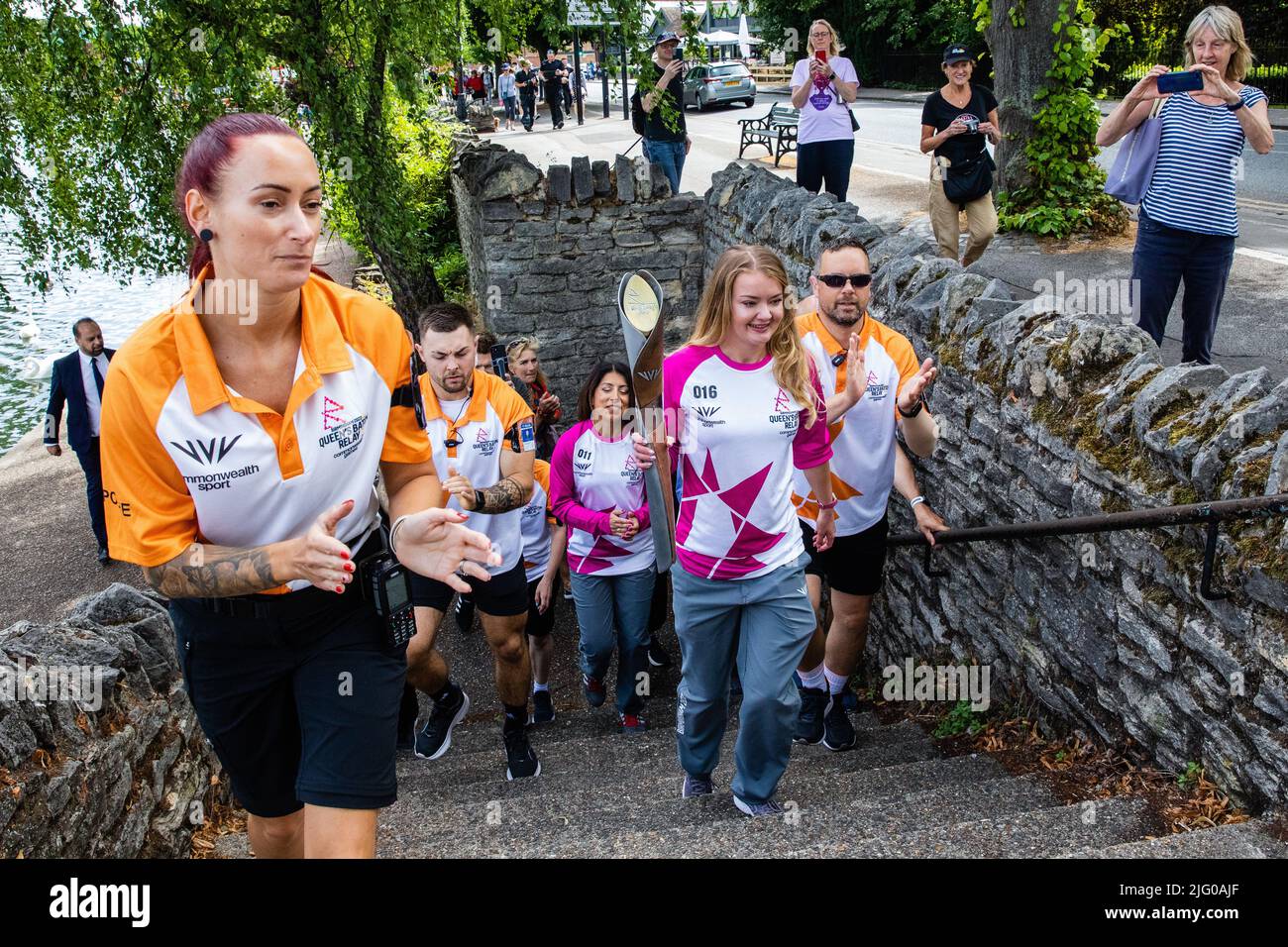 Windsor and Eton, UK. 6th July, 2022. Batonbearer Jemma Wood carries