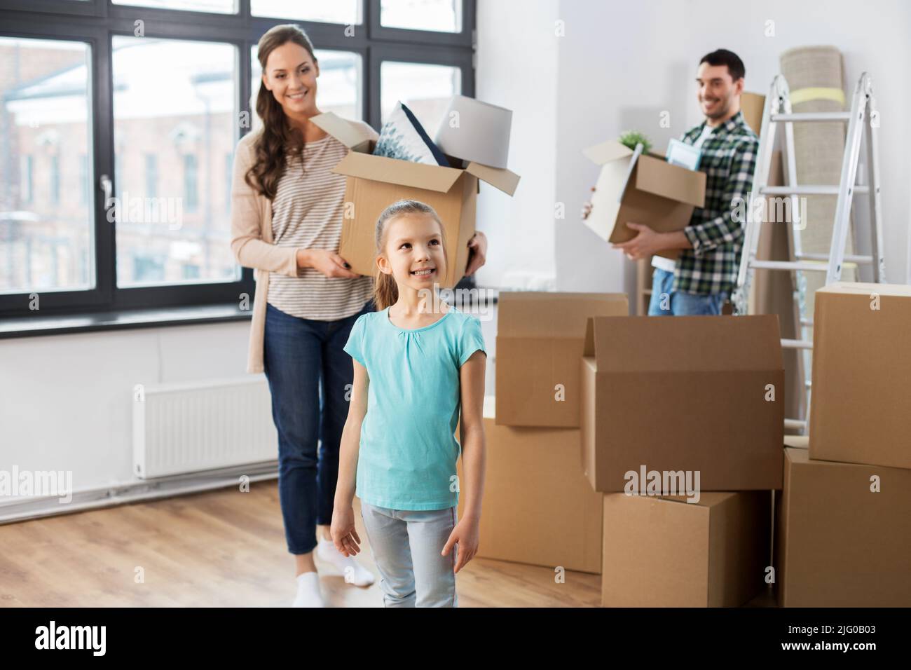 happy family with child moving to new home Stock Photo - Alamy