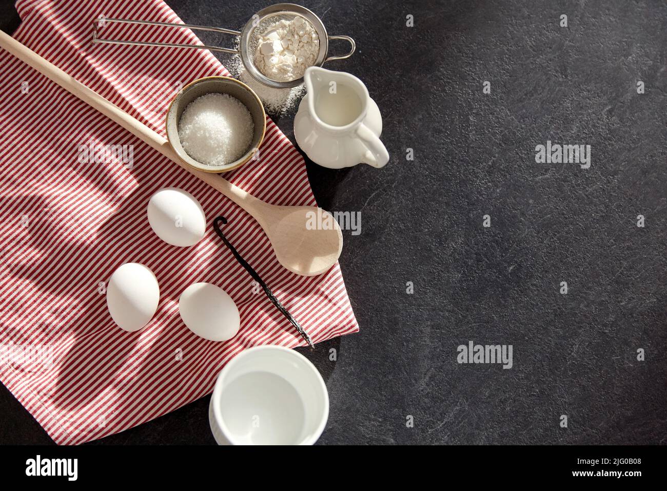 eggs, sugar, milk, flour, spoon and vanilla Stock Photo Alamy