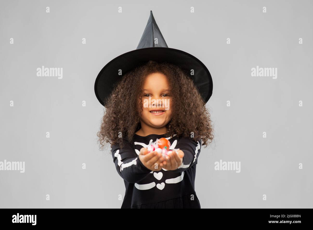 girl with candies trickortreating on halloween Stock Photo Alamy
