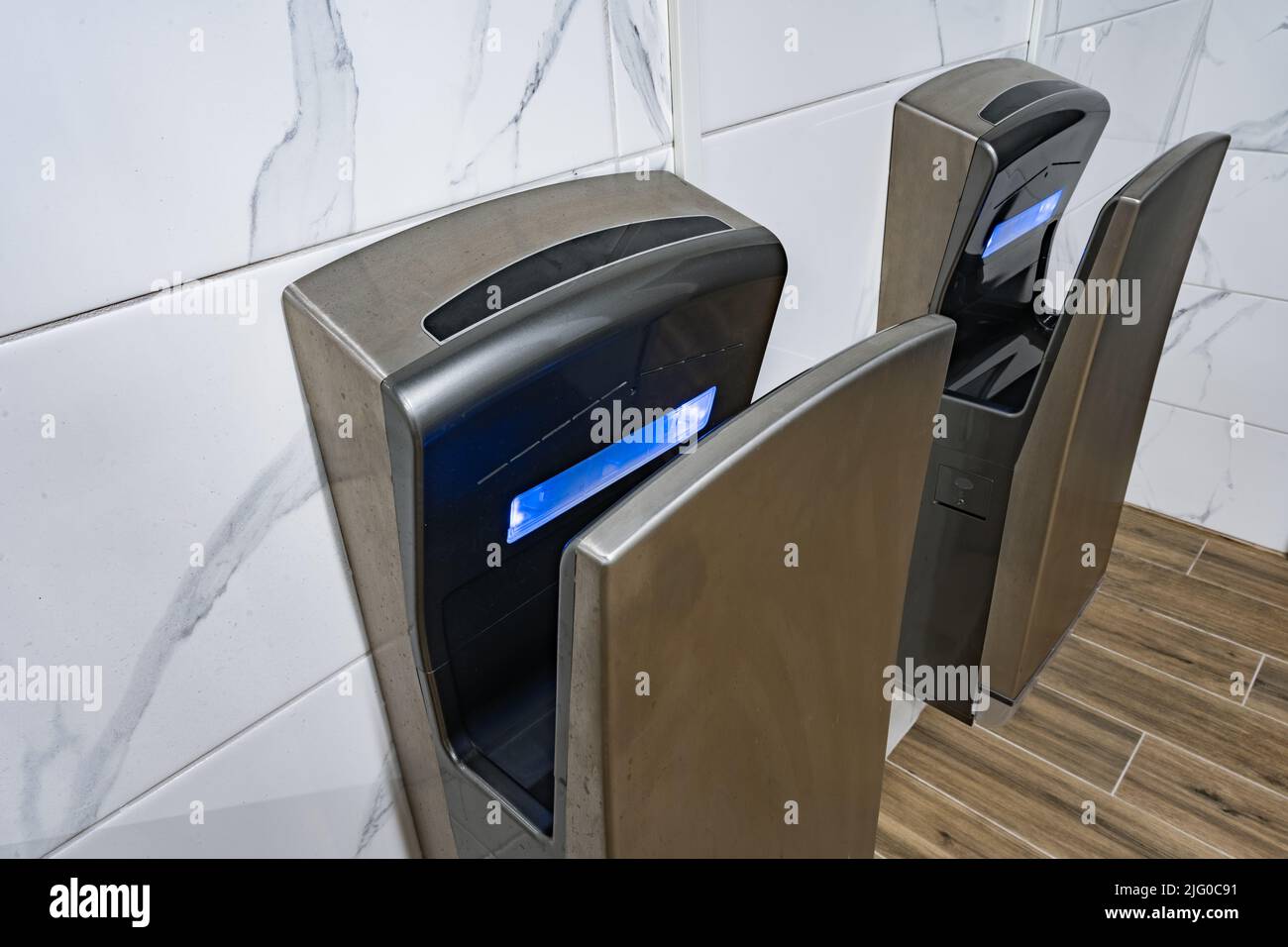 Modern hand dryers in public restroom WC Stock Photo Alamy