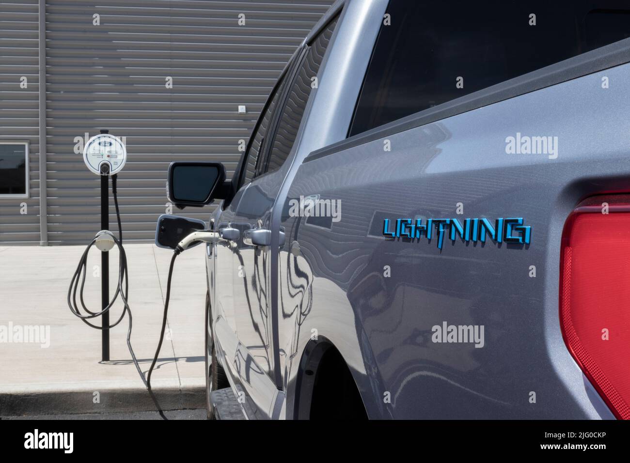 Kokomo - Circa July 2022: Ford F-150 Lightning display. Ford offers the F150 Lightning all-electric truck in Pro, XLT, Lariat, and Platinum models. Stock Photo