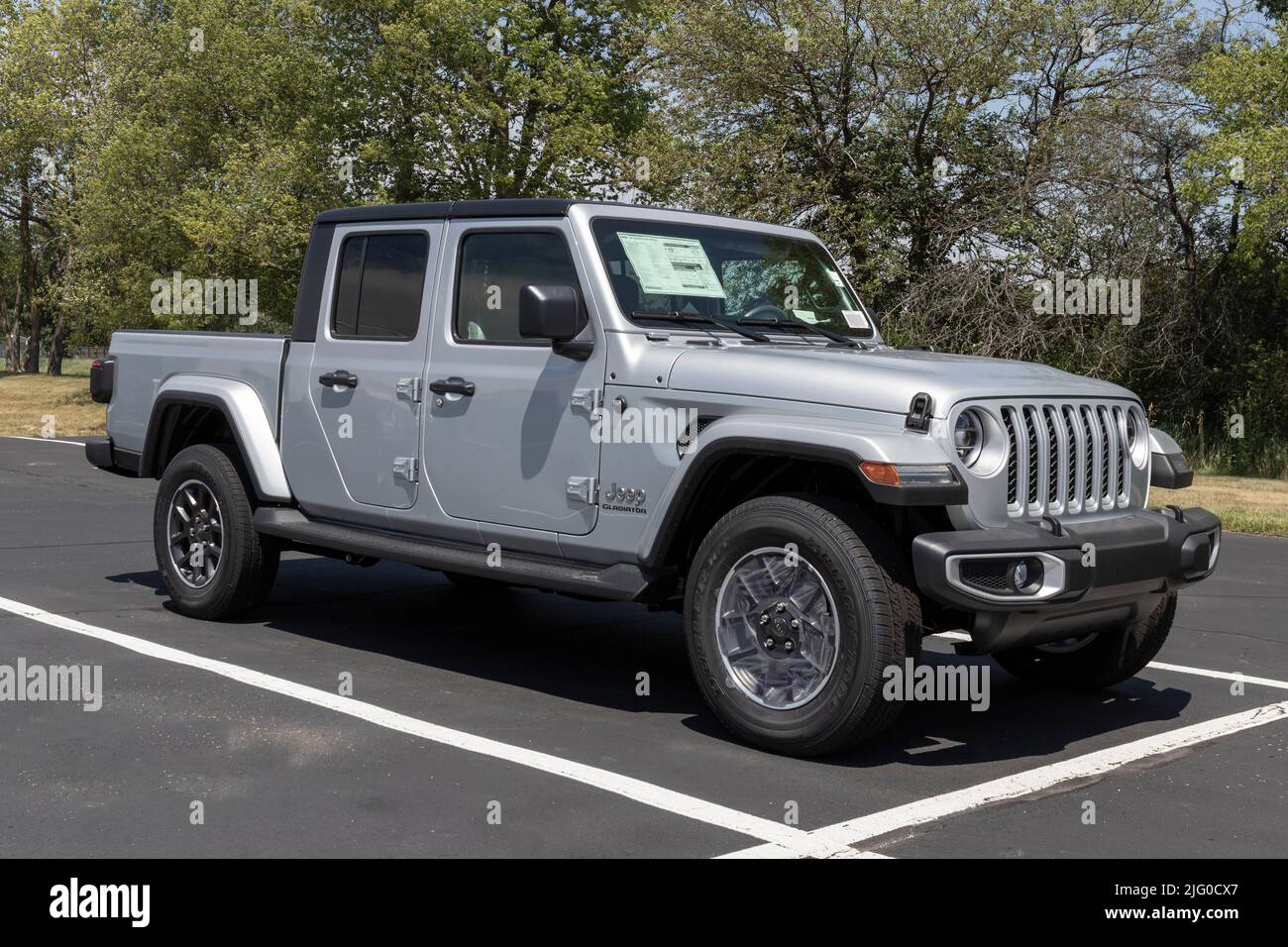 Kokomo - Circa July 2022: Jeep Gladiator display at a Stellantis dealer. The Jeep Gladiator models include the Sport, Willys, Rubicon and Mojave. Stock Photo