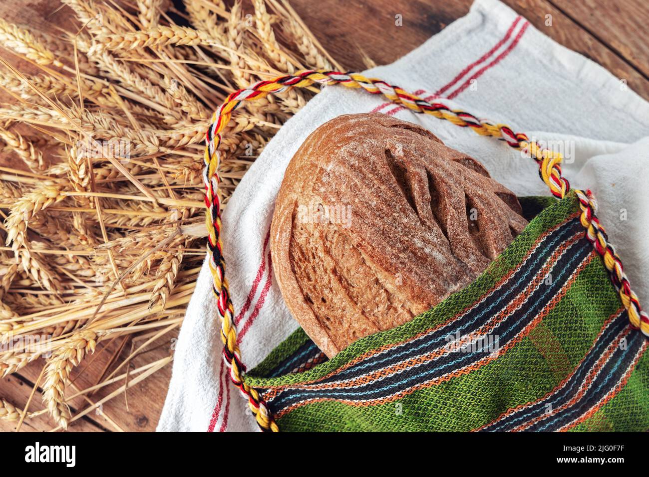 Fresh oven baked homemade sourdough bread in folklore bag. Bulgarian
