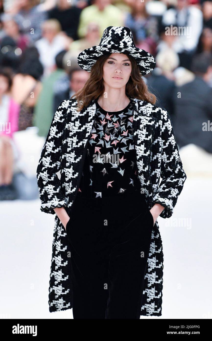 A model walks on the runway at the Chanel fashion show during the
