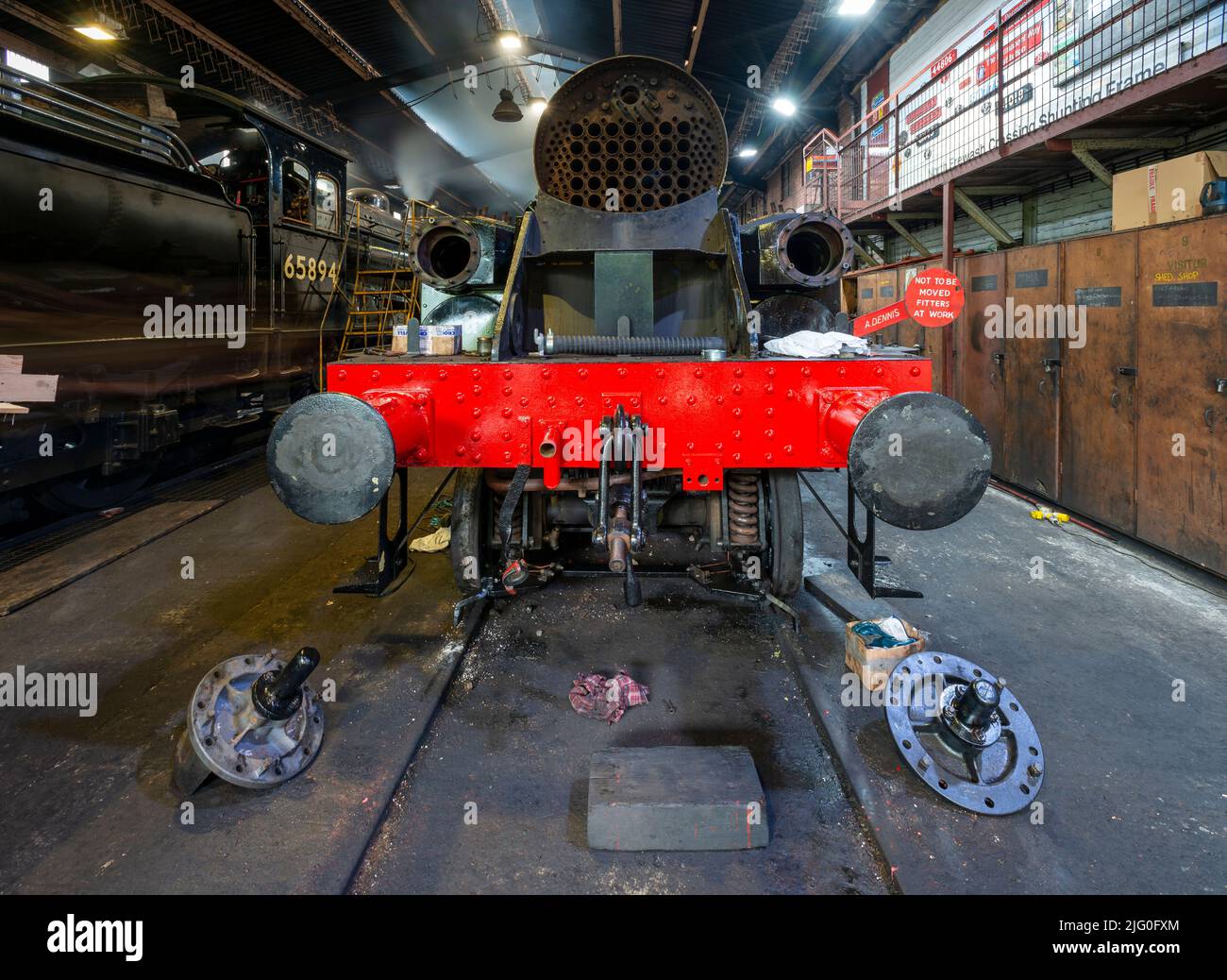 A steam engine undergoing a rebuild in the engine sheds at Grosmont Stock Photo