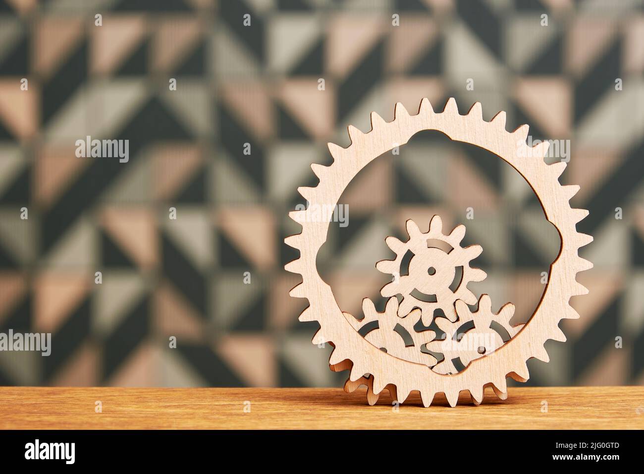 Complex mechanism with small wooden gears inside a big gear wheel