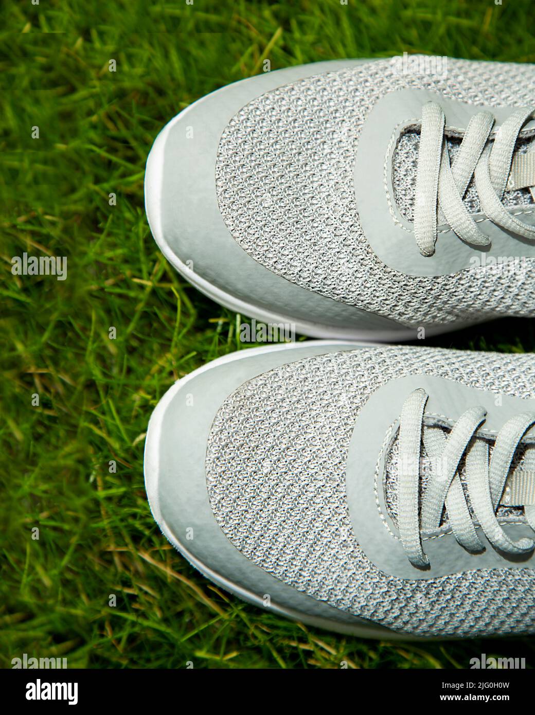 Shoes on the lawn grass. There are feet on the green lawn. copy space Stock Photo Alamy