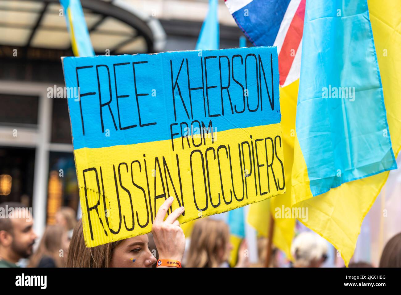 Ukraine war protest group at Pride London 2022, the fiftieth anniversary of the event. Parade marching along Piccadilly. Free Kherson from Russia Stock Photo