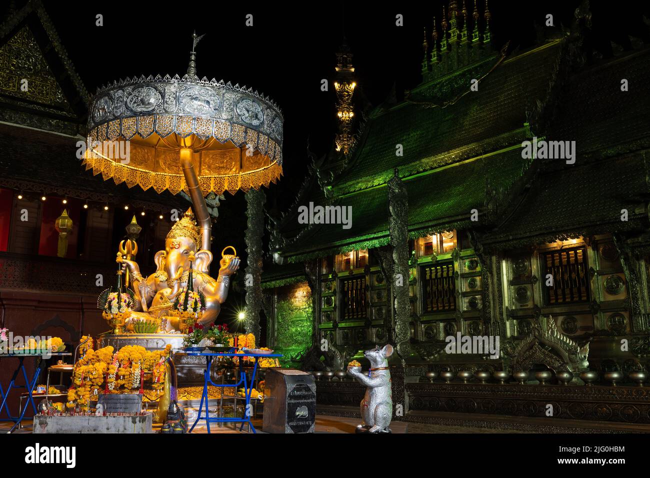 Ganesha statue and the Wat Si Suphan silver temple in Chiang Mai, Thailand Stock Photo