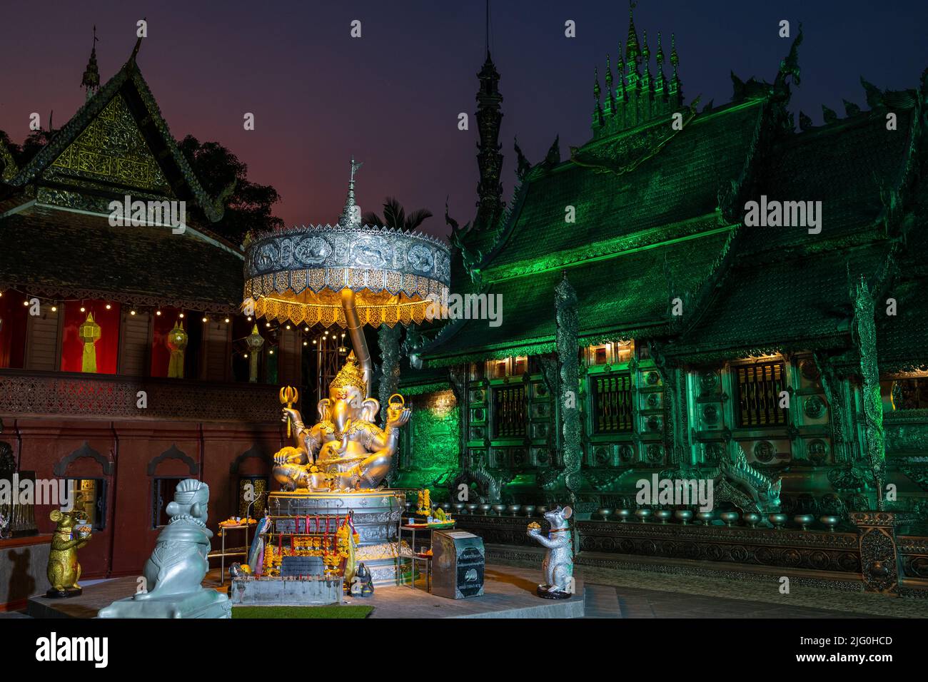 Ganesha statue and the Wat Si Suphan silver temple in Chiang Mai, Thailand Stock Photo