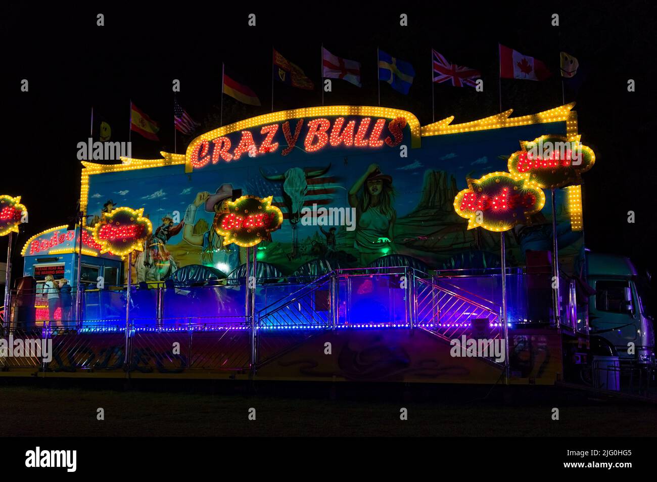 The Crazy Bulls fair ride at night during the annual May fair Stock ...