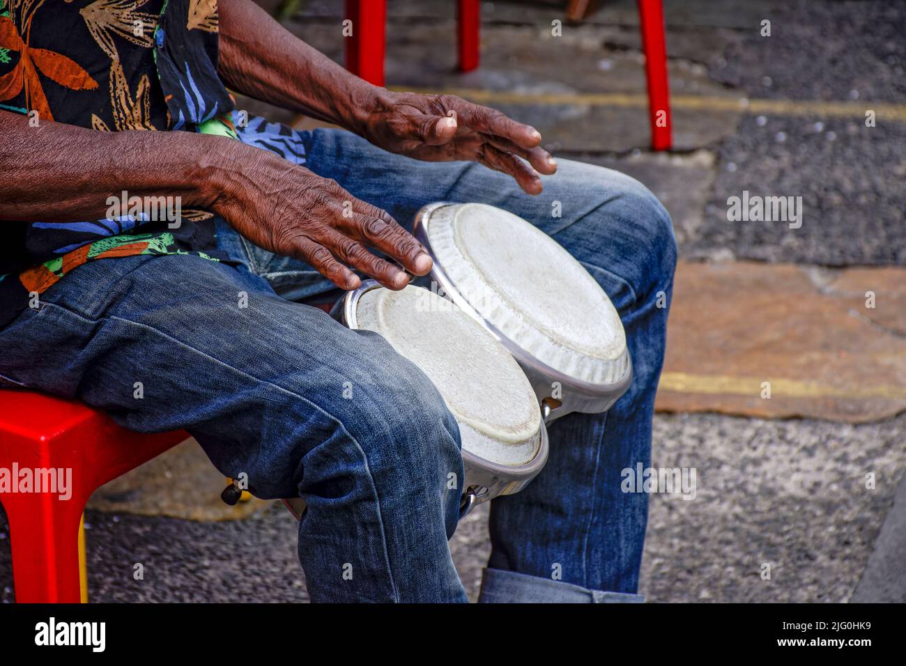 Percussionist playing bongo in the streets of historic Pelourinho district in Salvador, Bahia Stock Photo