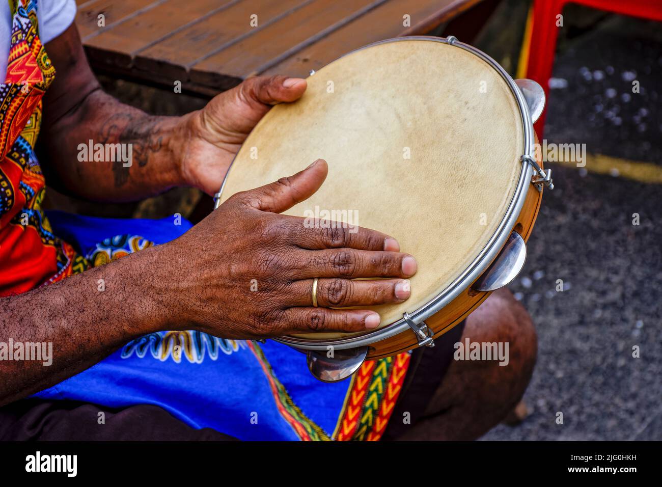 Percussionist playing tambourine in the famous streets of Pelourinho district in city of Salvador, Bahia Stock Photo