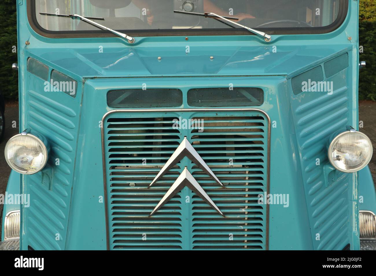 front of old turquoise blue vintage Citroën type H van Stock Photo