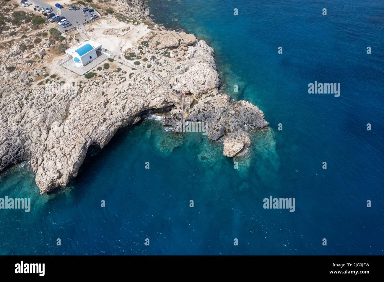 Drone aerial photograph of Cape Greko peninsula with Agyoi Anargyroi church on the rocks. Stock Photo