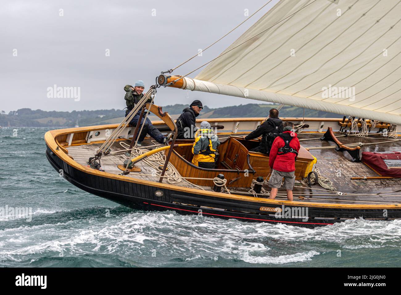 Large Classic wooden vessels, including Bristol Pilot Cutters, race in Carrick Roads in 32knots of wind (half gale) during Falmouth Classics Regatta Stock Photo