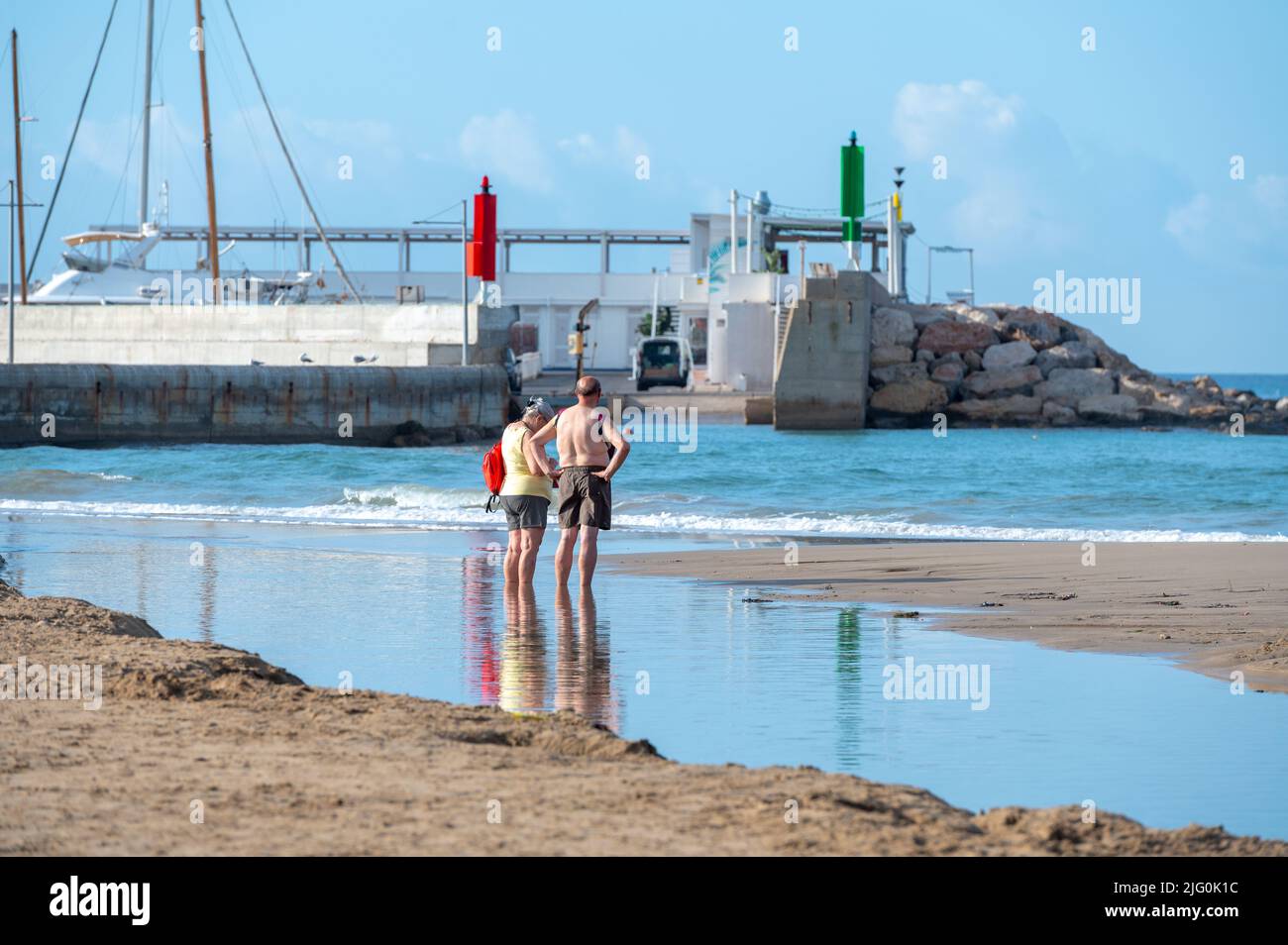 Coma Ruga, Spain . 2022 June 30 . People in the hot springs at the