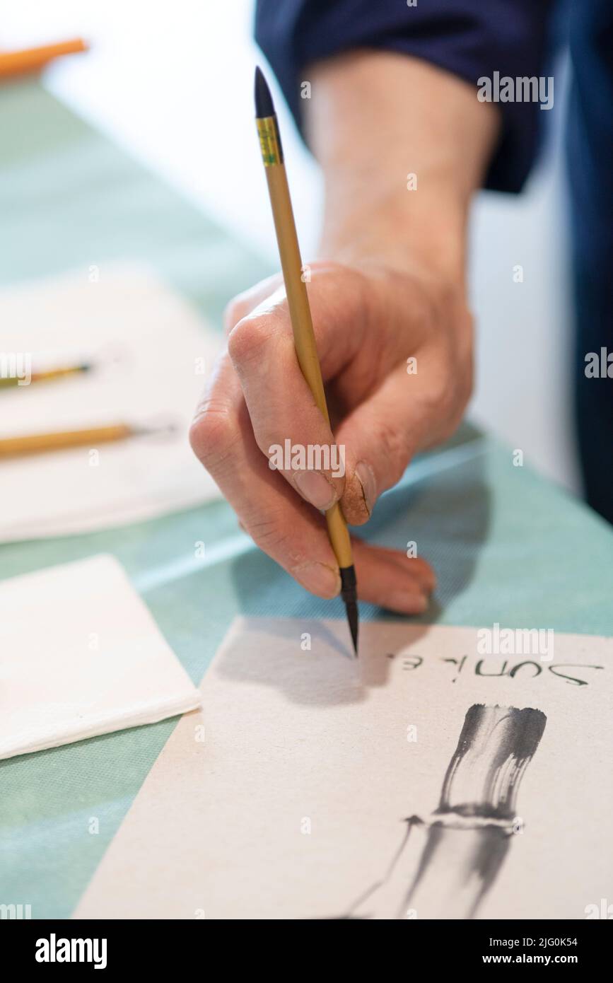 Sumie Artist Hand With a Brush Painting Stock Photo Alamy