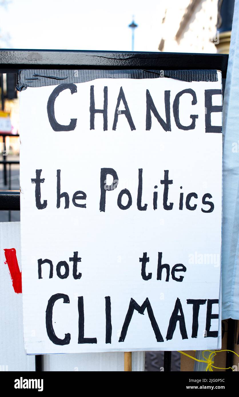 Signs at the Extinction Rebellion demonstration, in Parliament Square, London, in protest of world climate breakdown and ecological collapse. Stock Photo
