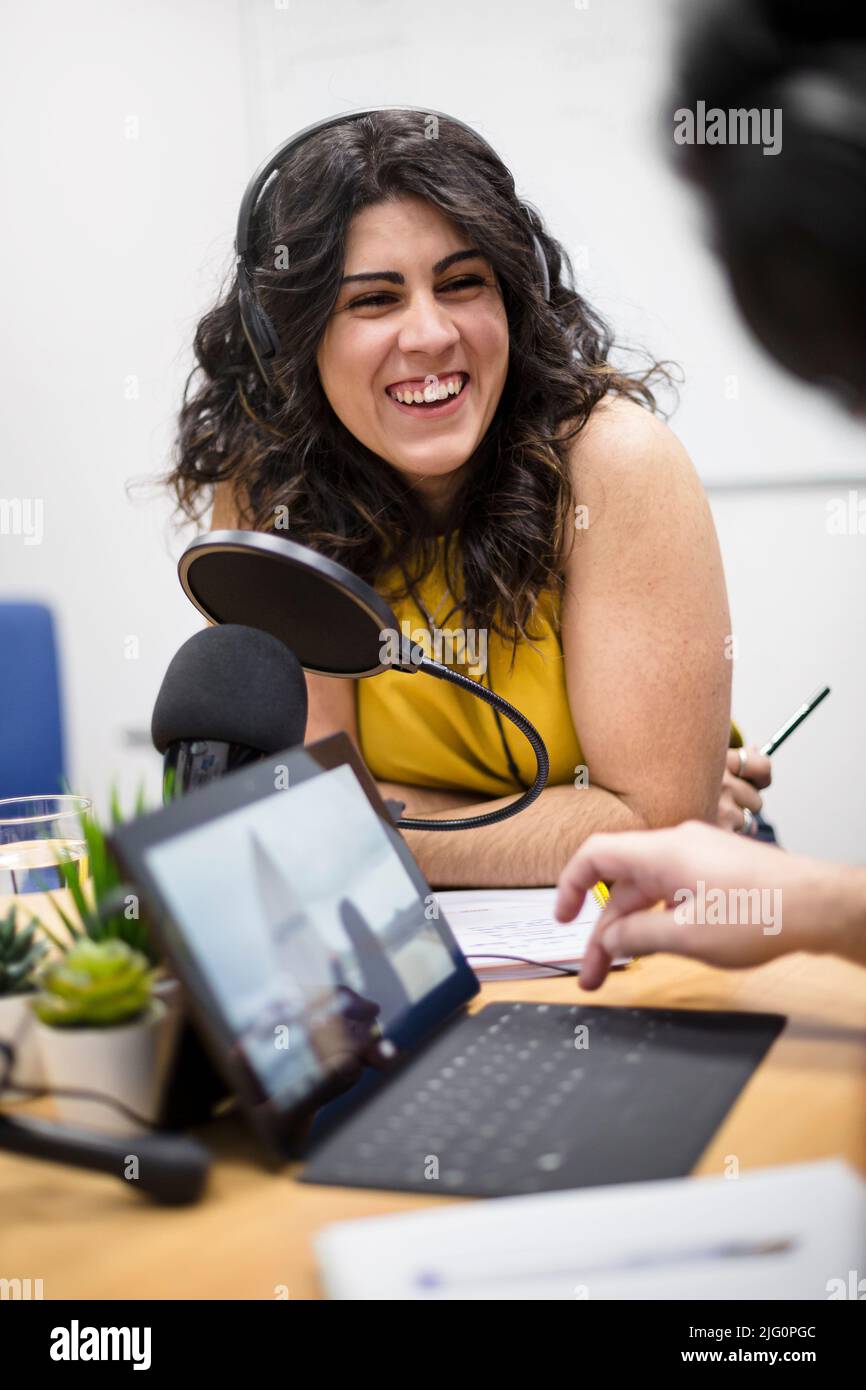 Portrait of young caucasian female radio presenter or podcaster