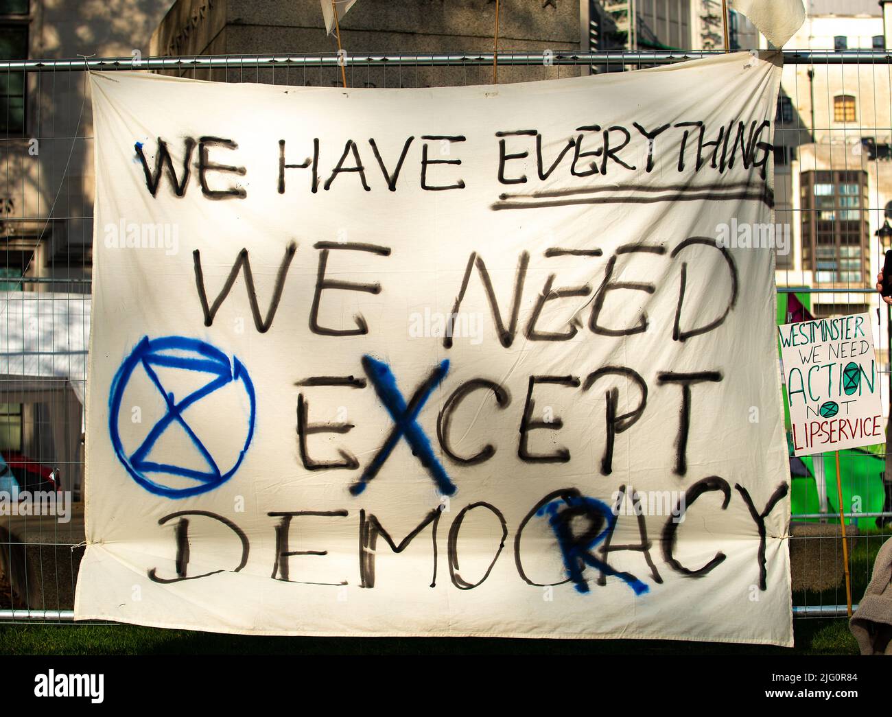 Signs at the Extinction Rebellion demonstration, in Parliament Square, London, in protest of world climate breakdown and ecological collapse. Stock Photo