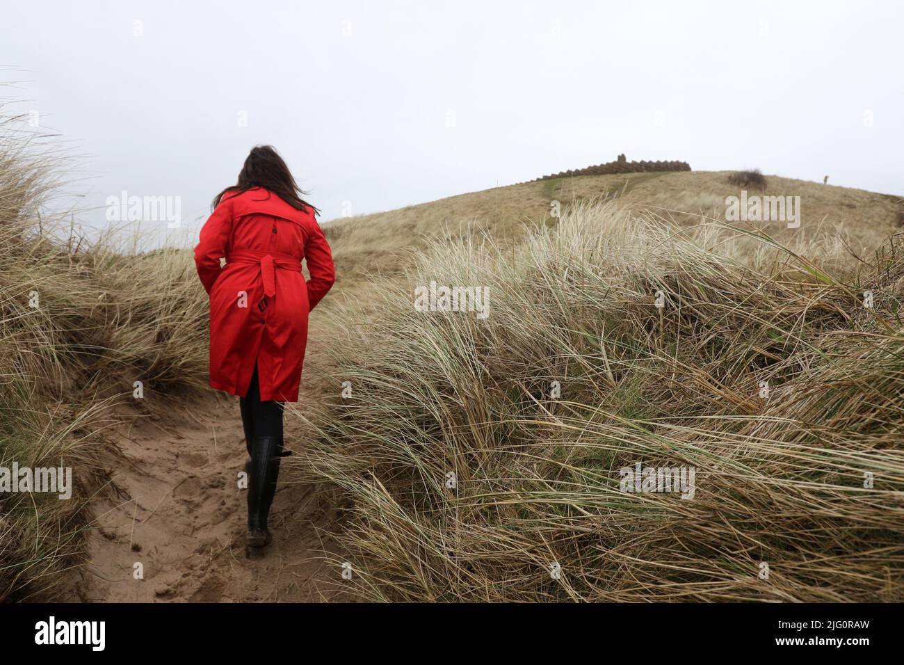 Woman coat back windy hi-res stock photography and images - Alamy