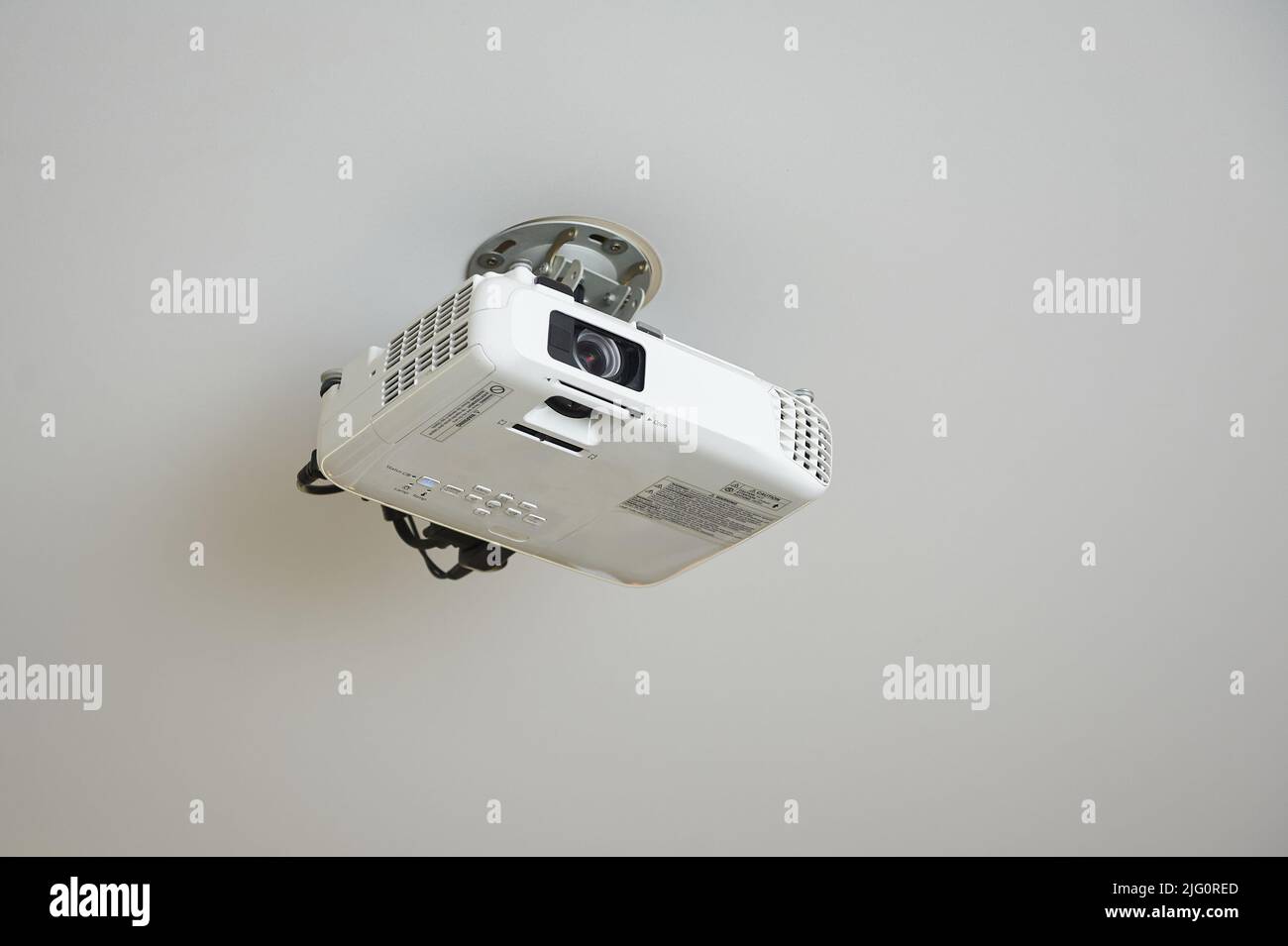 Video projector is installed on the ceiling for presentations. Stock Photo