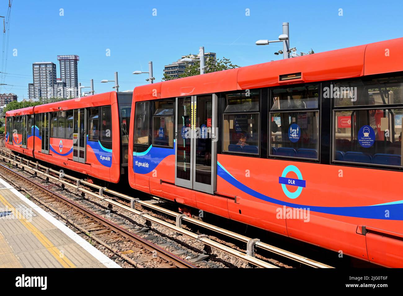 London, England - June 2022: Train stopped at the Royal Victoria station on the Docklands Light Railway Stock Photo