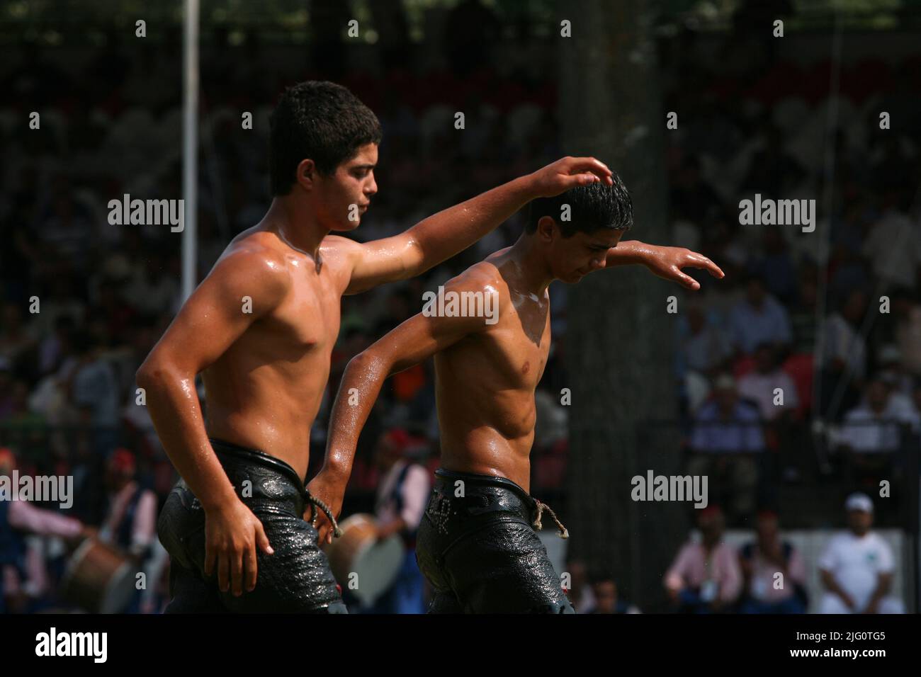 Kırkpınar (Turkish Oil Wrestling). Young wrestlers march through the stadium before their fights during the 648th Kırkpınar Tournament in Edirne, Turkey, on 5 July 2009. Kırkpınar wrestlers compete stripped to the waist and smeared their bodies with olive oil. Stock Photo