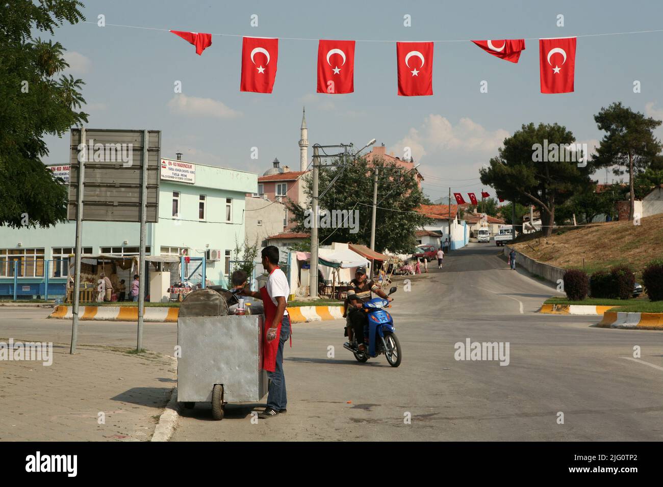 Street vendor on the street decorated with Turkish national flags in Edirne, Turkey. Stock Photo