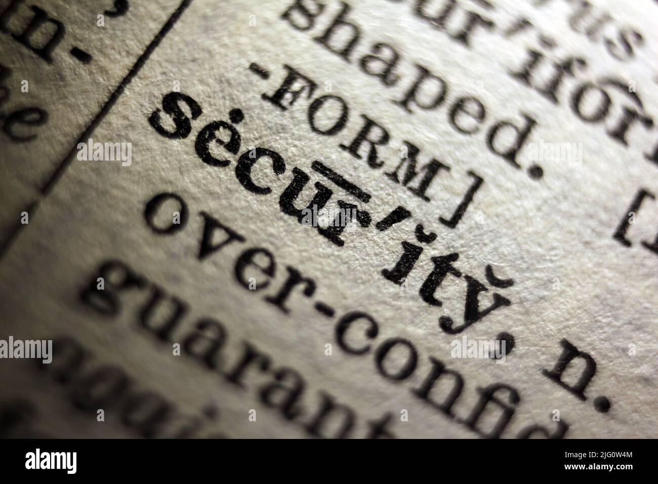 Word 'security' printed on dictionary page, macro close-up Stock Photo