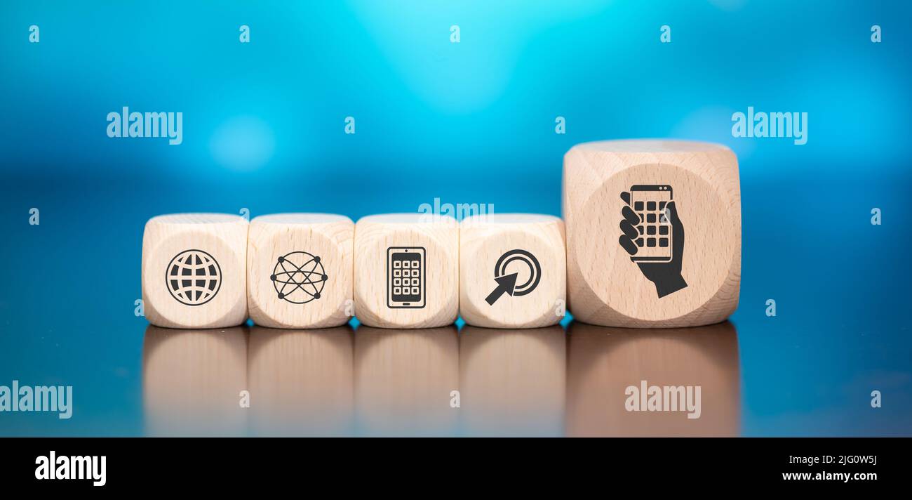 Wooden blocks with symbol of apps concept on blue background Stock