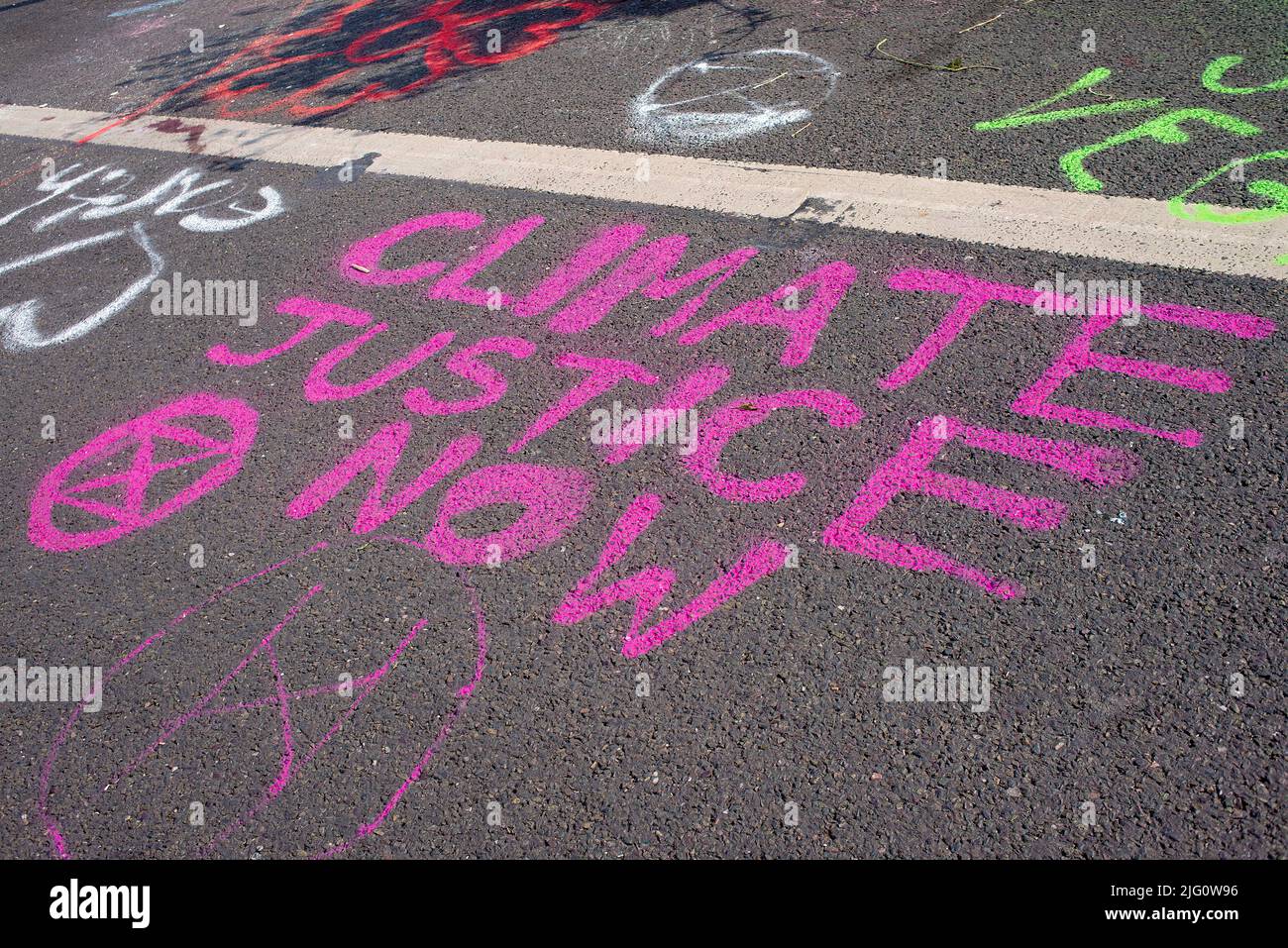 Waterloo Bridge, London, covered in colorful slogans by supporters of the Extinction Rebellion campaign in protest of world ecological climate change. Stock Photo