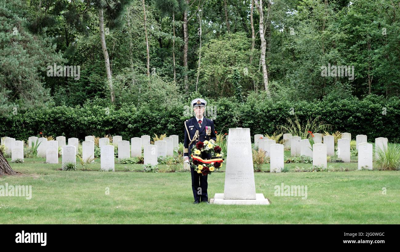 Sun 3rd July 22.Captain (Naval) Flamant, Belgian Defence Attaché holds the Belgian Ambassador's wreath at the Belgian WW2 Memorial at the Belgian Plot of Brookwood Military Cemetery. Stock Photo
