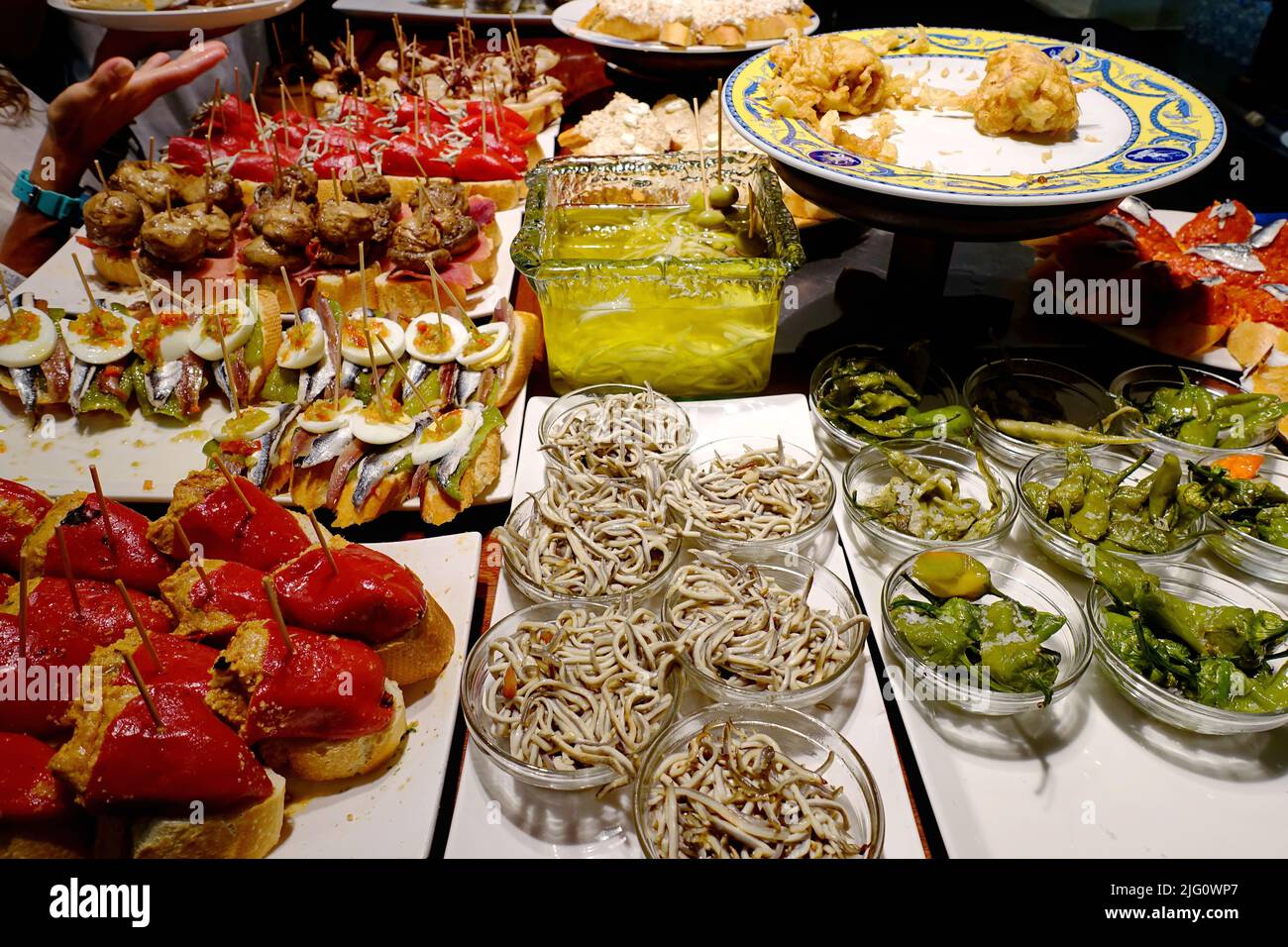 A tapas bar in San Sebastian with delicious pintxos, the traditional appetizers of the Basque country. San Sebastian, Spain - August 2018 Stock Photo