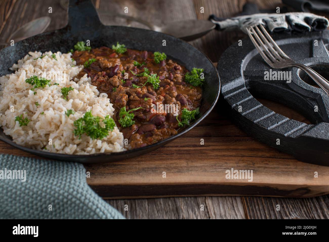 Bodybuilding meal with low fat ground beef, kidney beans, vegetables and tomato sauce. Served with brown rice. Stock Photo