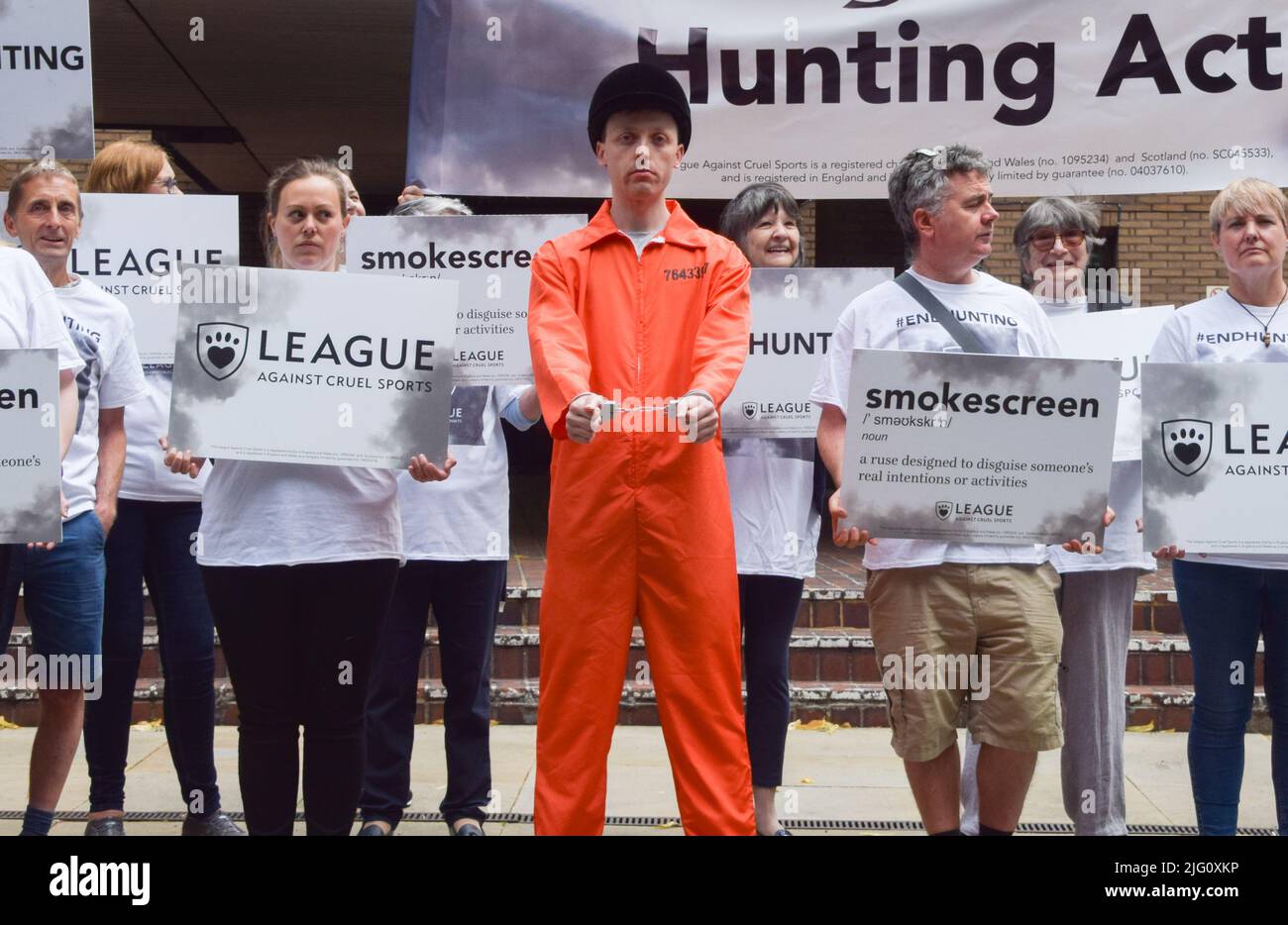 London, England, UK. 6th July, 2022. An activist is dressed as a convicted fox hunter. Activists gathered outside Southwark Crown Court in protest against fox hunting and called for the Hunting Act to be strengthened as the appeal hearing for Mark Hankinson begins. Hankinson was found guilty of encouraging or assisting others to use ''trail hunting'' as a cover for illegally chasing and killing foxes. (Credit Image: © Vuk Valcic/ZUMA Press Wire) Stock Photo