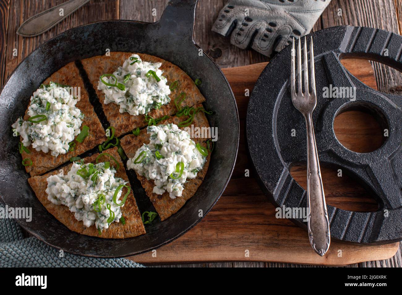 Fitness breakfast  with oatmeal pancake, cottage cheese and herbs Stock Photo