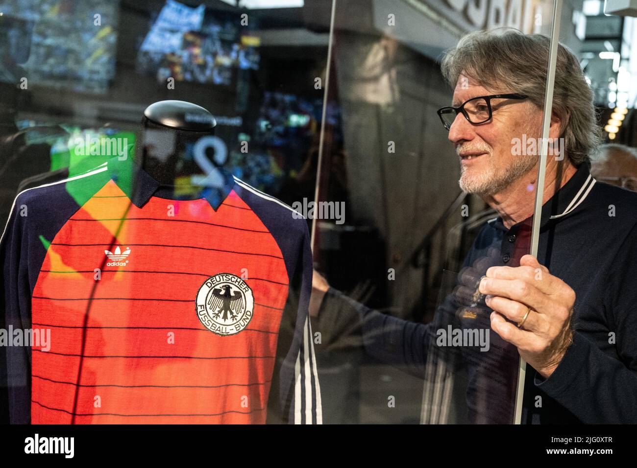 Dortmund, Germany. 06th July, 2022. National goalkeeper Toni Schumacher  looks at his former jersey from the 1982 World Cup semifinal match against  France at the German Football Museum. To commemorate the 40th