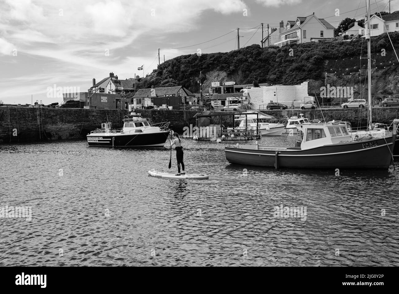 Paddleboarding in Porthleven harbour, Cornwall Stock Photo Alamy