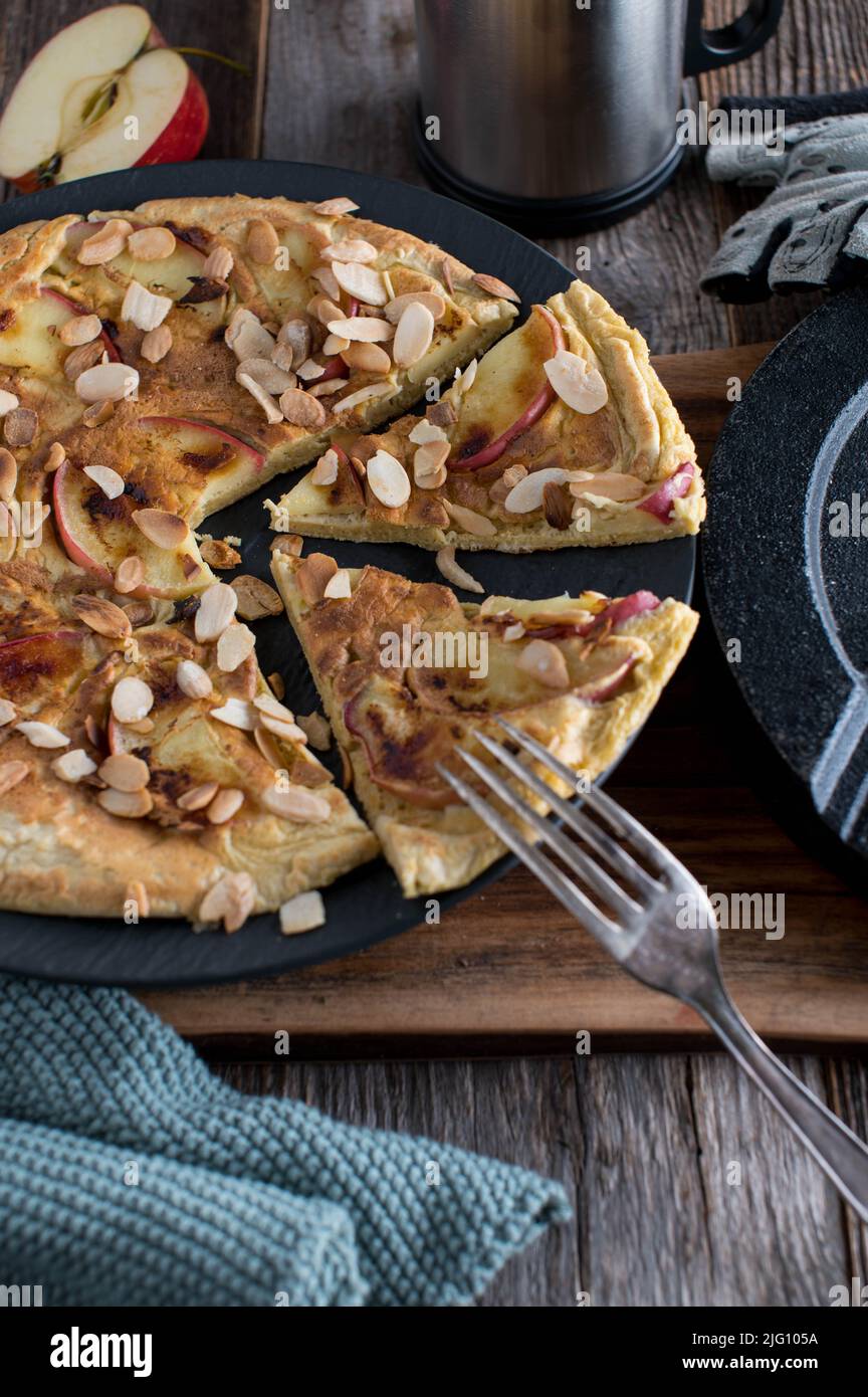 Protein pancake homemade cooked with eggs and oats. Baked with apples and topped with roasted almonds Stock Photo